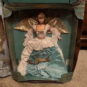 Angel of Joy Barbie. Box is a little dented. Never used . Smoke free home